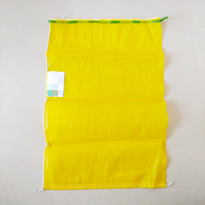 Yellow Circular Mesh bags with label+overlock
